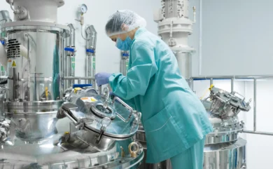 pharmaceutical factory woman worker protective clothing